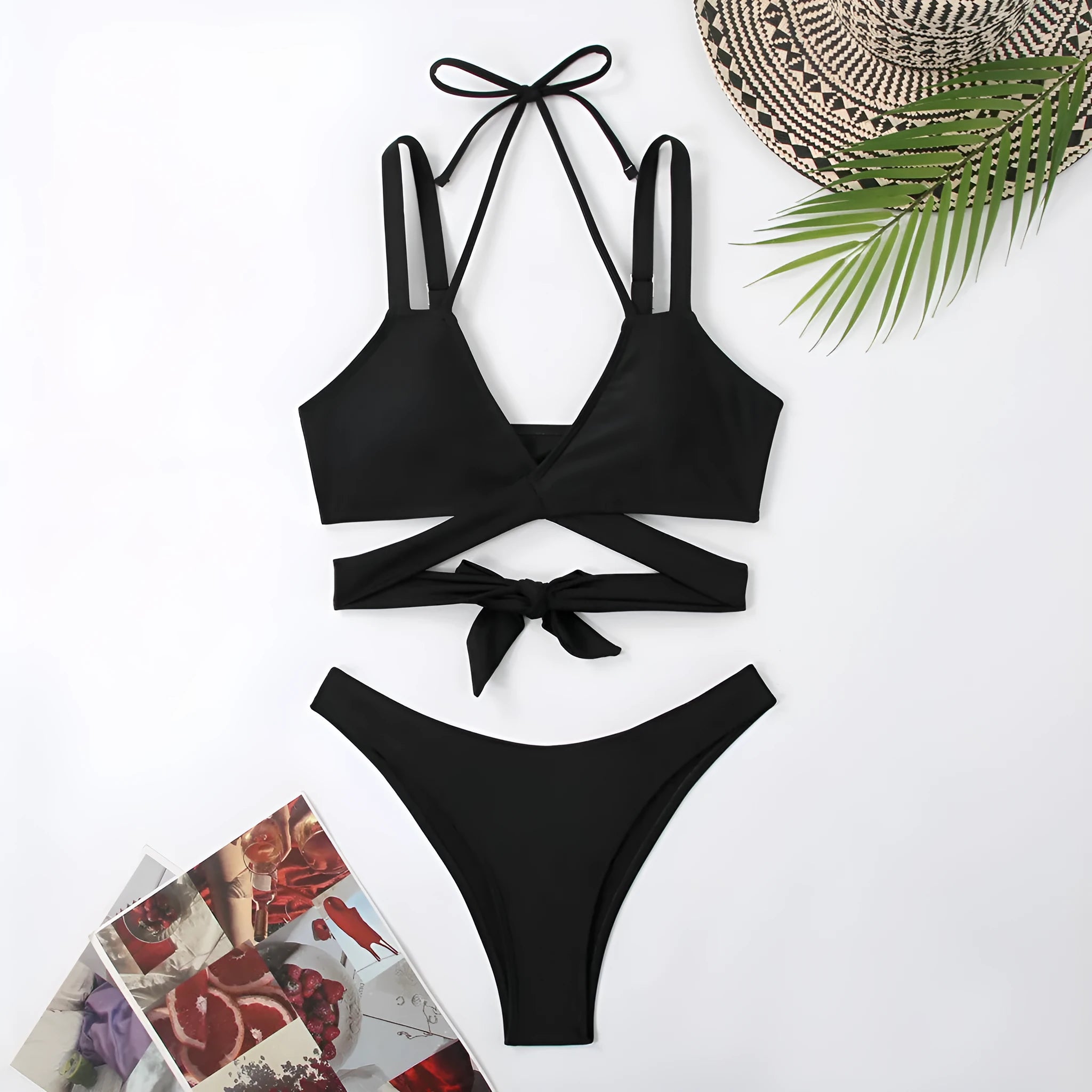 Women's solid colour strap bikini swimsuit on a mannequin, shown in black.