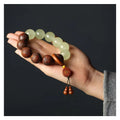 Rosewood bracelet with amass fortunes fu character carving and 20mm wooden beads