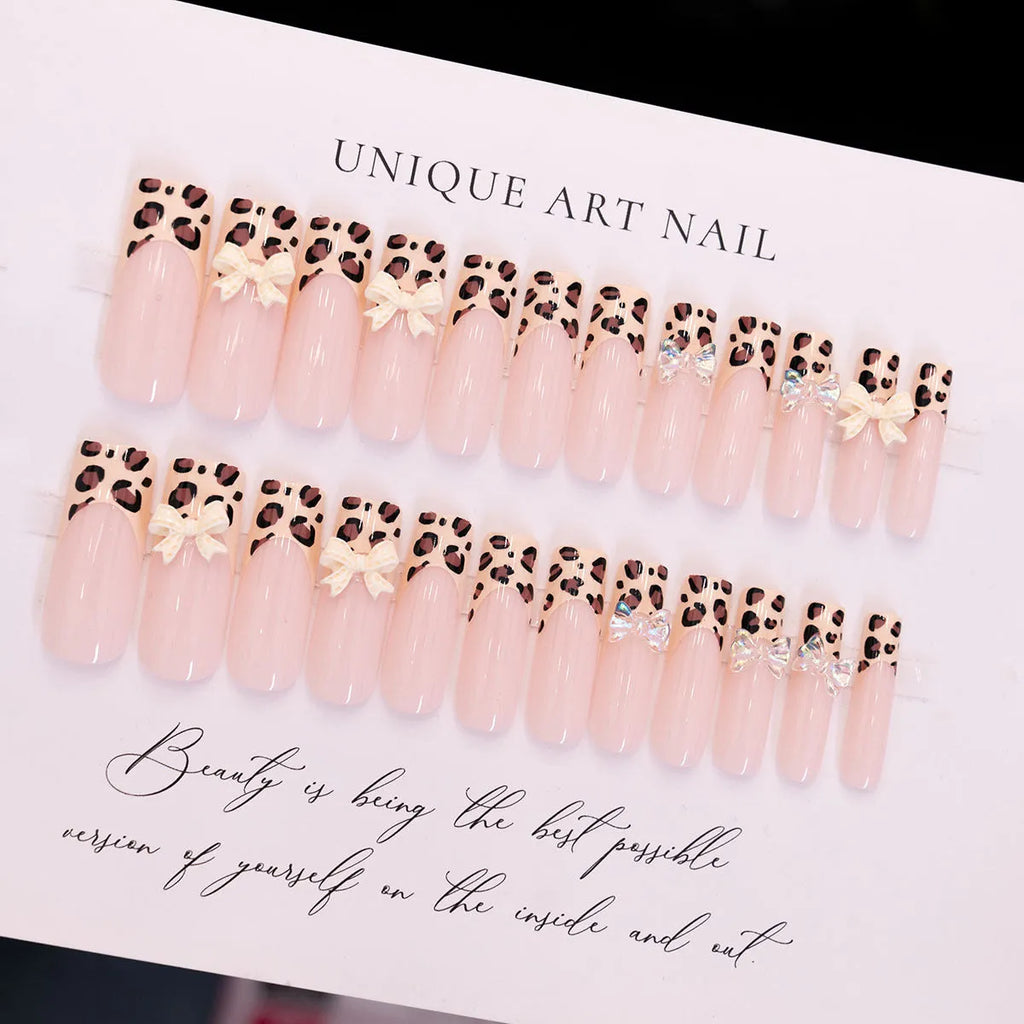 Leopard print pattern on a 3D plastic butterfly nail art charm for manicure decoration.