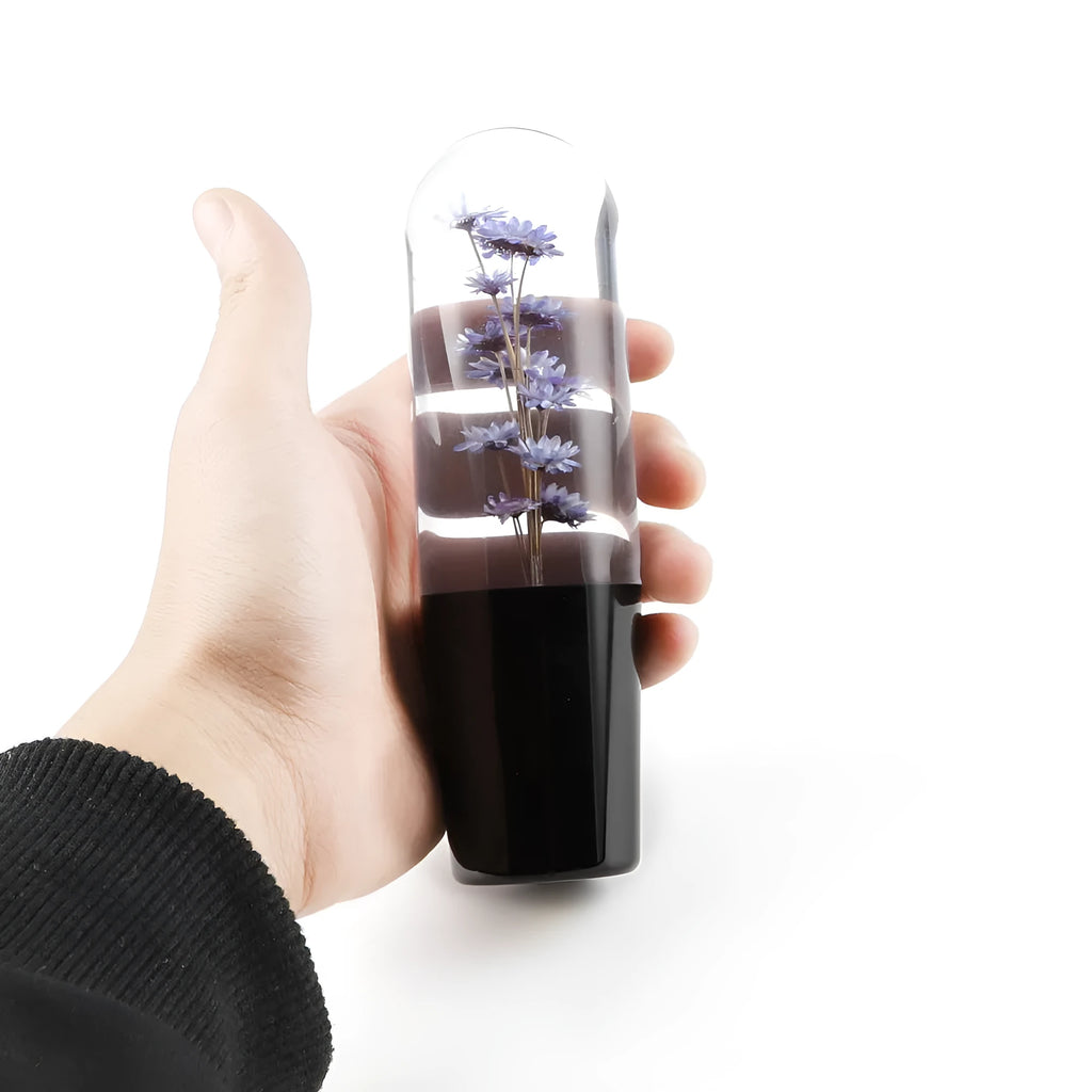 15cm transparent crystal JDM car gear knob with three metal adapters on a purple background.