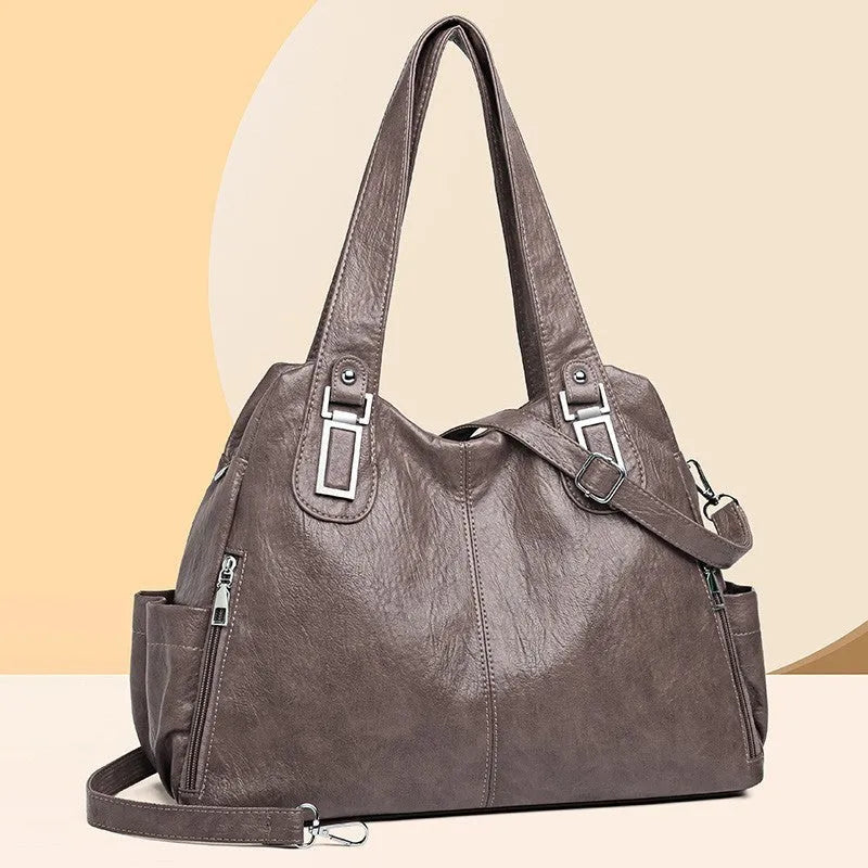 Soft square women's tote bag in various colours with a single shoulder strap and zip pocket inside.