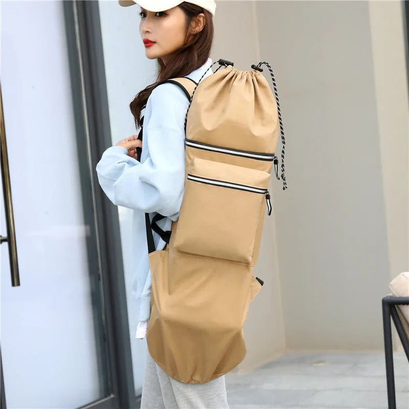 Black waterproof nylon skateboard duffel bag with long main compartment for a 90cm board or fishing rods.