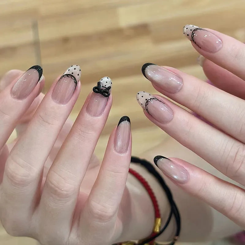 Sweet Girl Wearing Fake Nails set showing medium length coffin-shaped press-on nails with random colour designs.