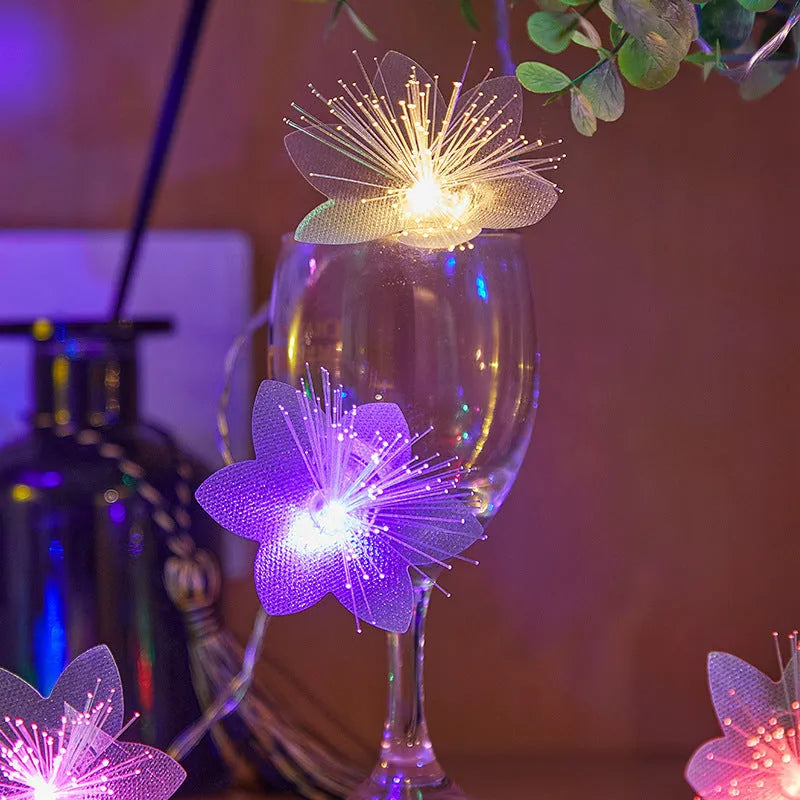 LED optical fibre flower light string with 20 warm white beads and battery box on a table decoration
