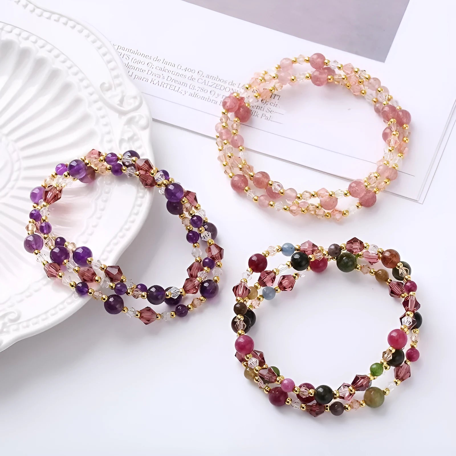 Women's three-ring bracelet with tourmaline, strawberry quartz and amethyst gemstones on adjustable cord