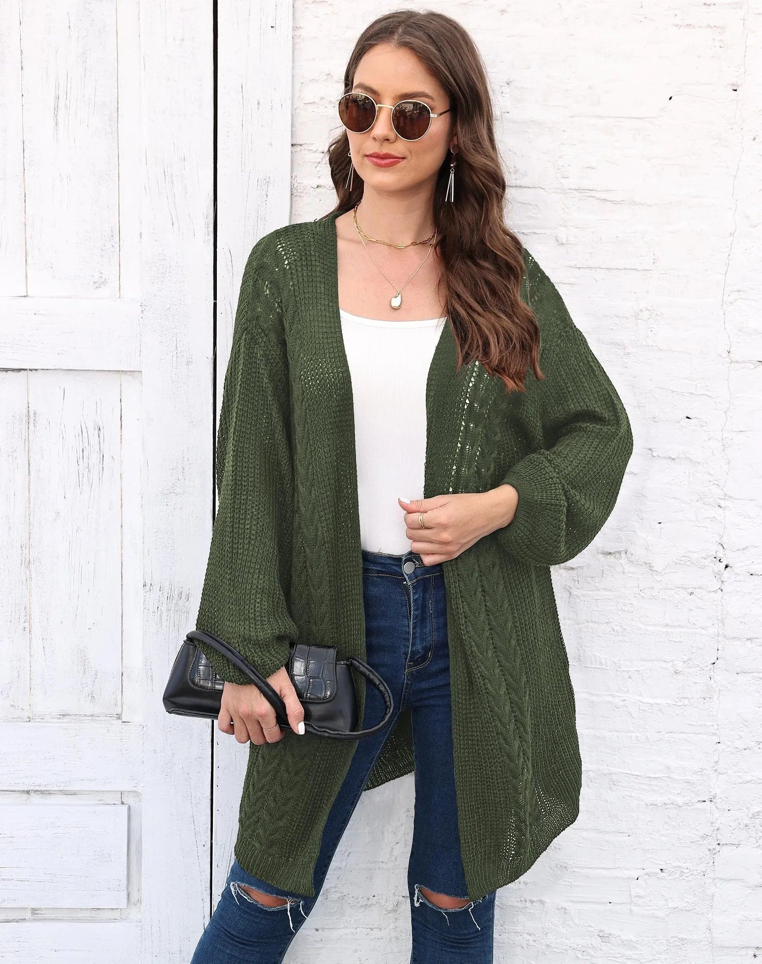 Women's loose longline acrylic cardigan sweater coat in a solid colour.