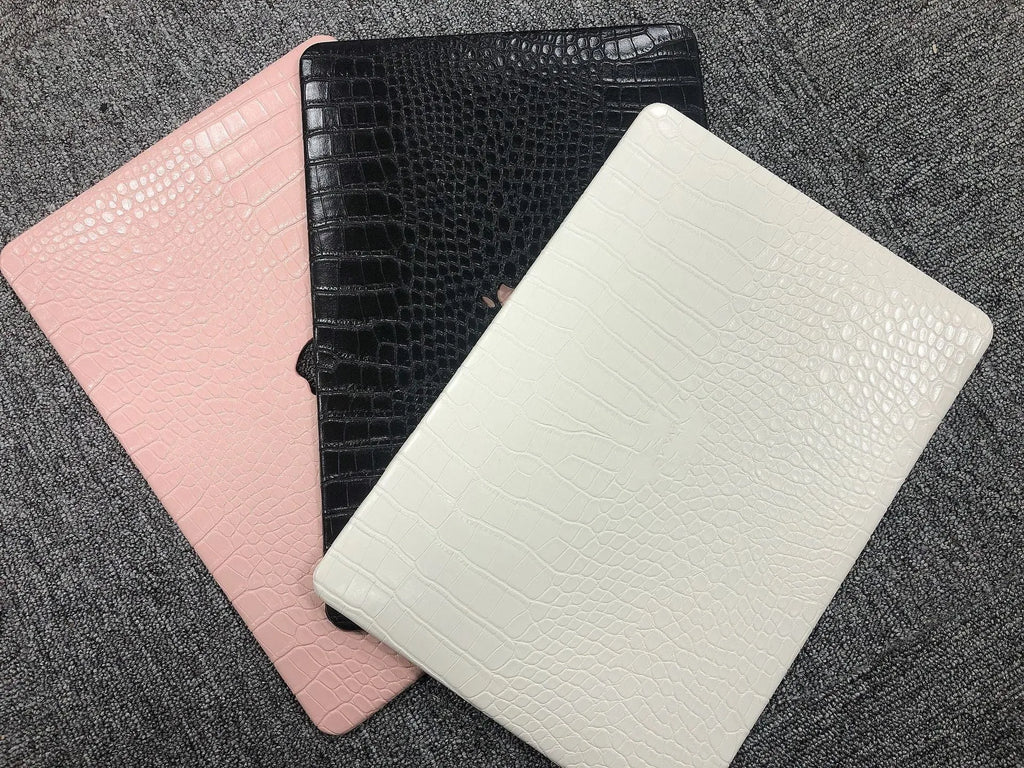 MacBook laptop protective case with leather pattern texture and hollowed-out Apple logo in black colour