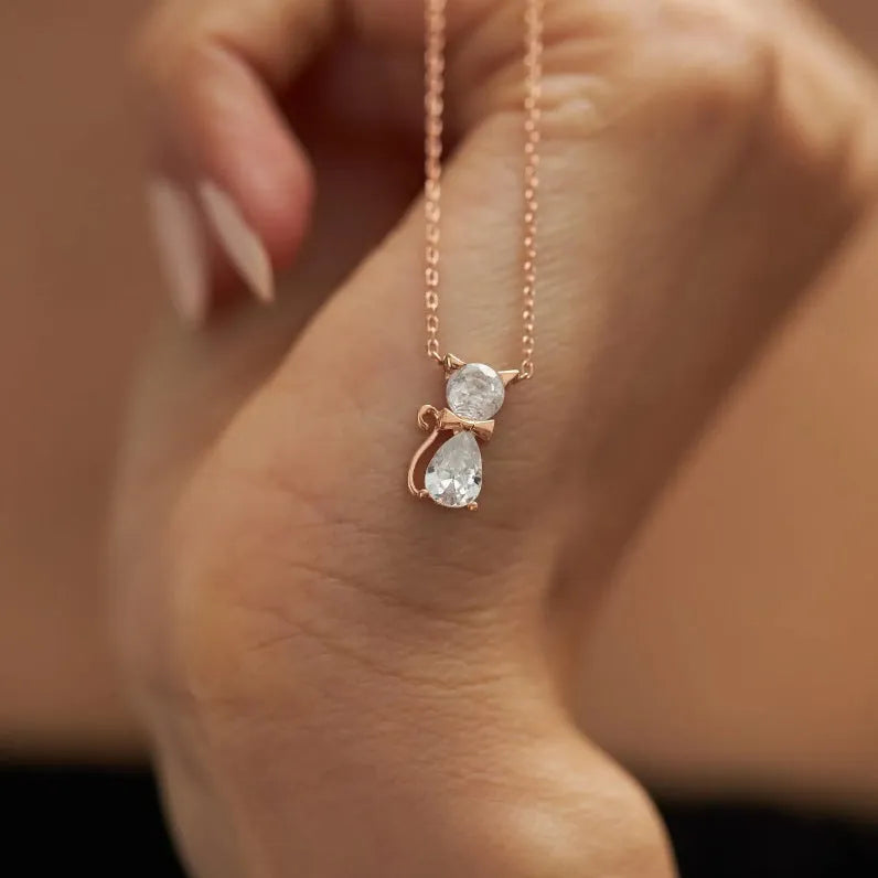 Sweet fashion necklace with titanium steel kitty pendant and coloured zircon stones on copper water wave chain.