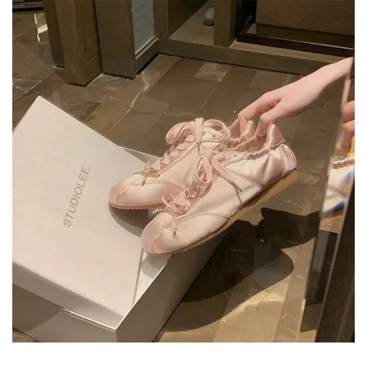 Women's silver grey satin ballet style sports board shoes with round toe and front lace-up design
