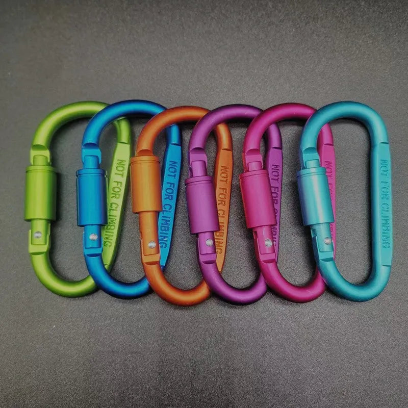 D-type aluminium locking carabiner in a selection of ten colours on a grey background.