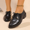 Women's British-style loafers with a bow detail on a PU upper and rubber sole.
