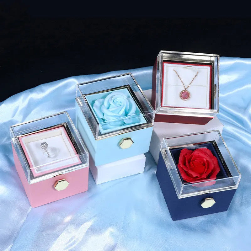 Rotating drawer jewellery gift box with red preserved rose under clear acrylic dome, showing open compartment.