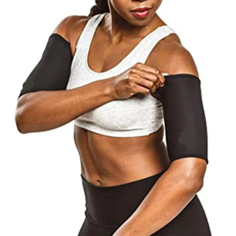 Compression sports arm sleeve in black and red colour, worn on forearm during workout.