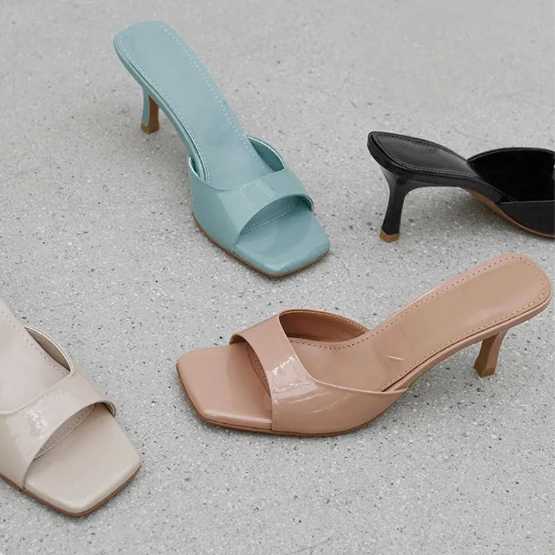 Women's square toe stiletto heel sandals in nude, black, and white on a rubber sole