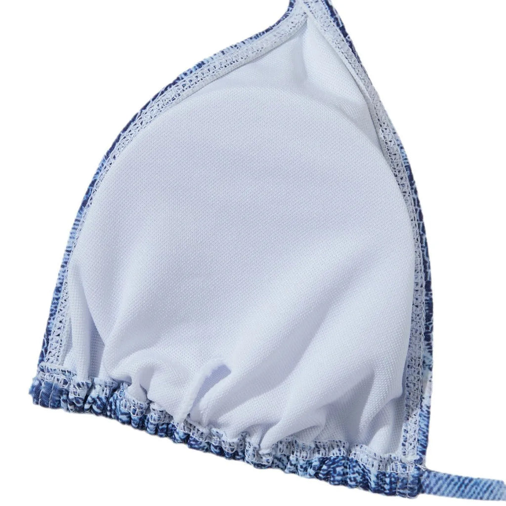 Denim blue printed bikini top and bottom set for women on a mannequin.