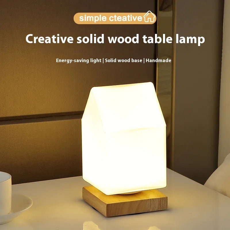 Nordic solid wood flower-shaped USB table lamp with touch dimming control on a desk.