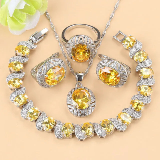 Mixed gem-inlaid copper jewellery set including pendant necklace, earrings, ring, and bracelet in green colour