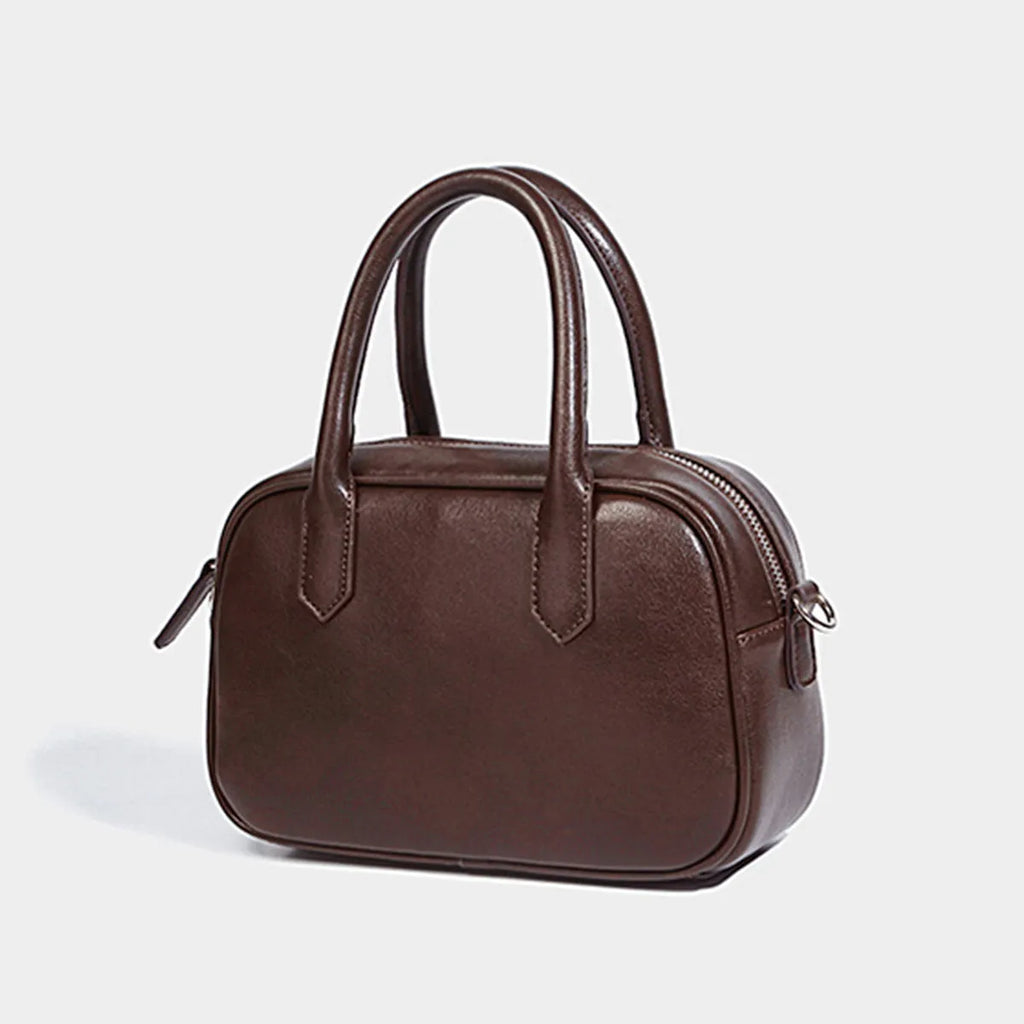 Small square retro messenger bag in black or coffee colour with single shoulder strap