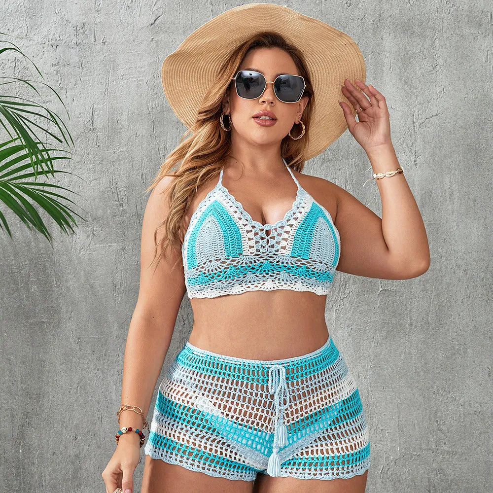 Blue women's brief-style swimsuit with hollow-out strap detail on a mannequin.