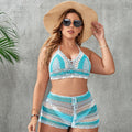 Blue women's brief-style swimsuit with hollow-out strap detail on a mannequin.