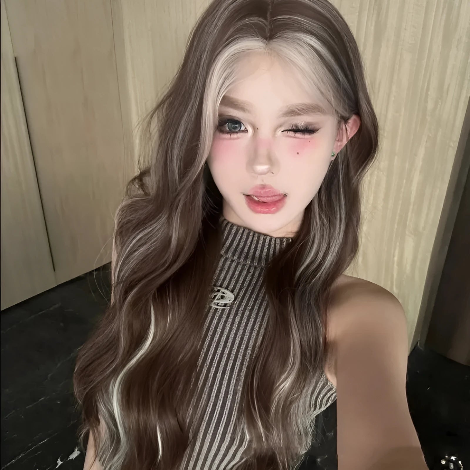 Long curly grey gold synthetic wig with lace front and highlights.