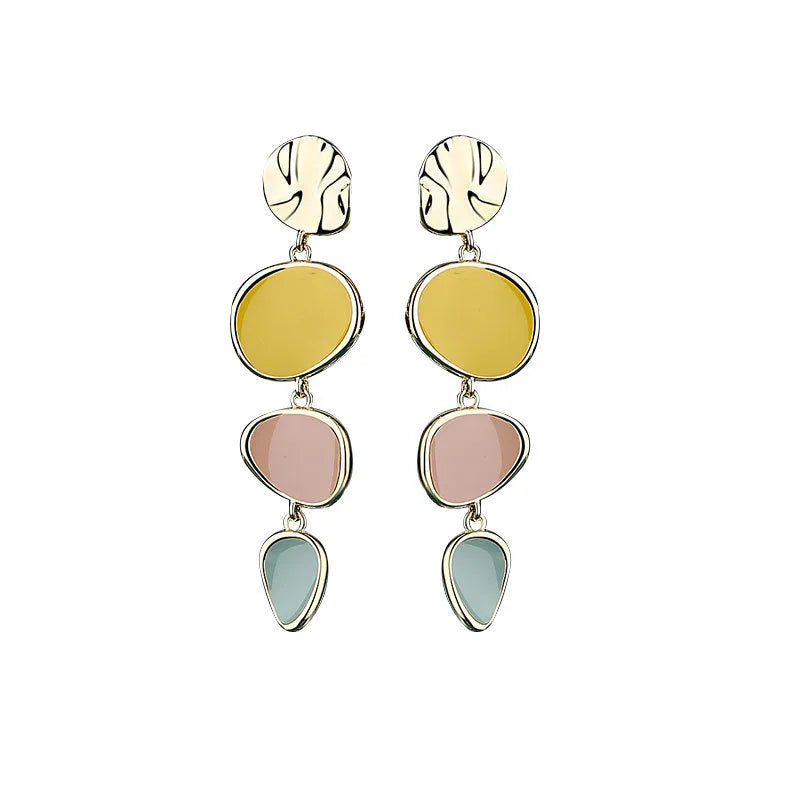 A pair of simple disc-shaped earrings with a blended Morandi colour finish on a sterling silver post.