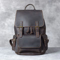 Brown crazy horse leather backpack with denim lining and double shoulder straps.