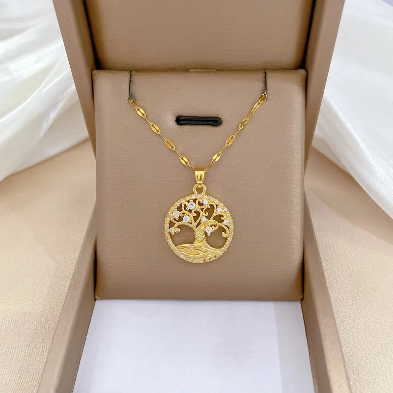 Gold-colour adjustable necklace with a mother-of-pearl pendant featuring a sparkling zircon lucky tree inlay.