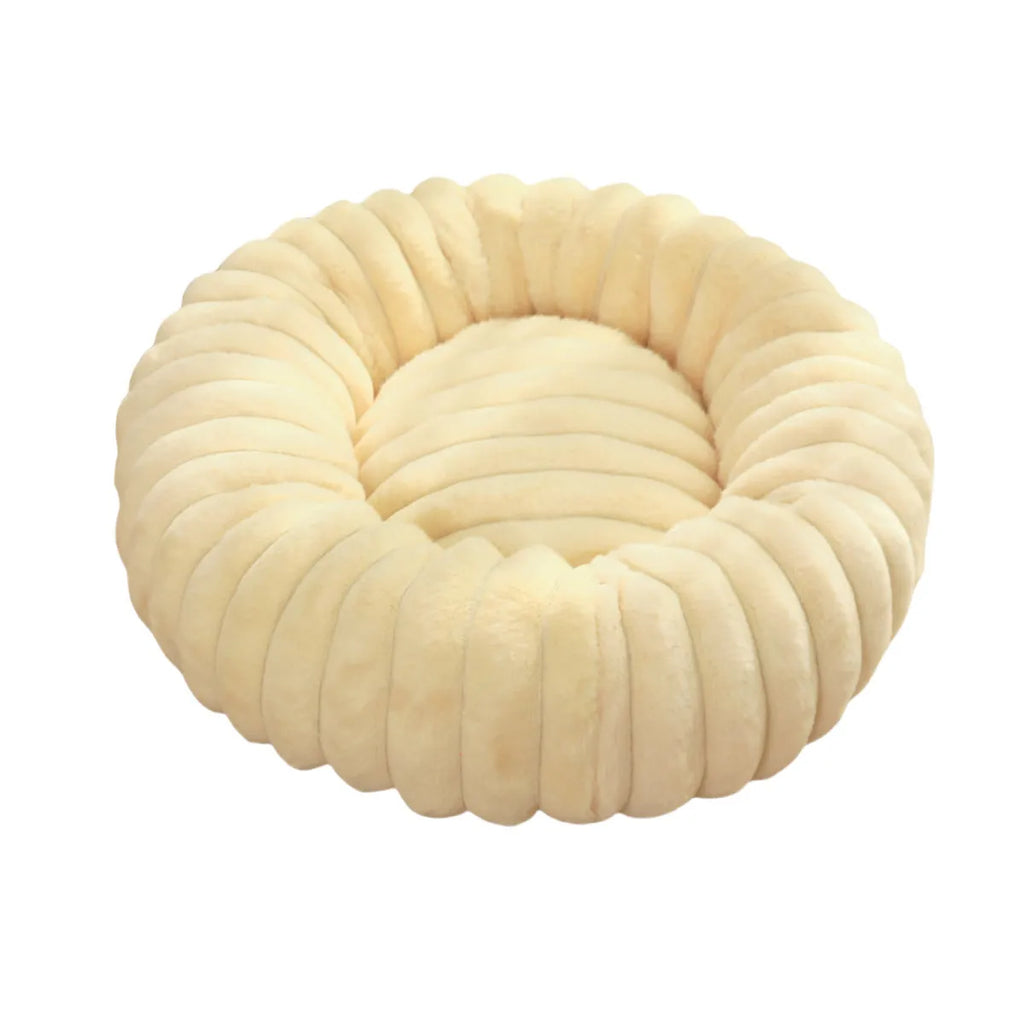 Round plush pet mat in beige, showing long-hair texture and circular shape