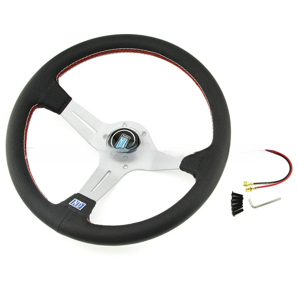 Black leather 14-inch steering wheel with deep middle concave grip and silver three-spoke skeleton.