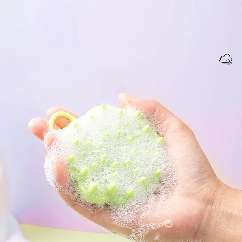 Handheld silicone pet grooming brush for wet and dry use, shown in assorted colours.