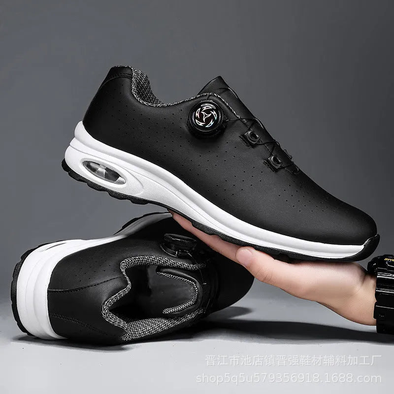 Man's black and white low-top casual tennis shoes with mesh upper and cross shoulder straps.