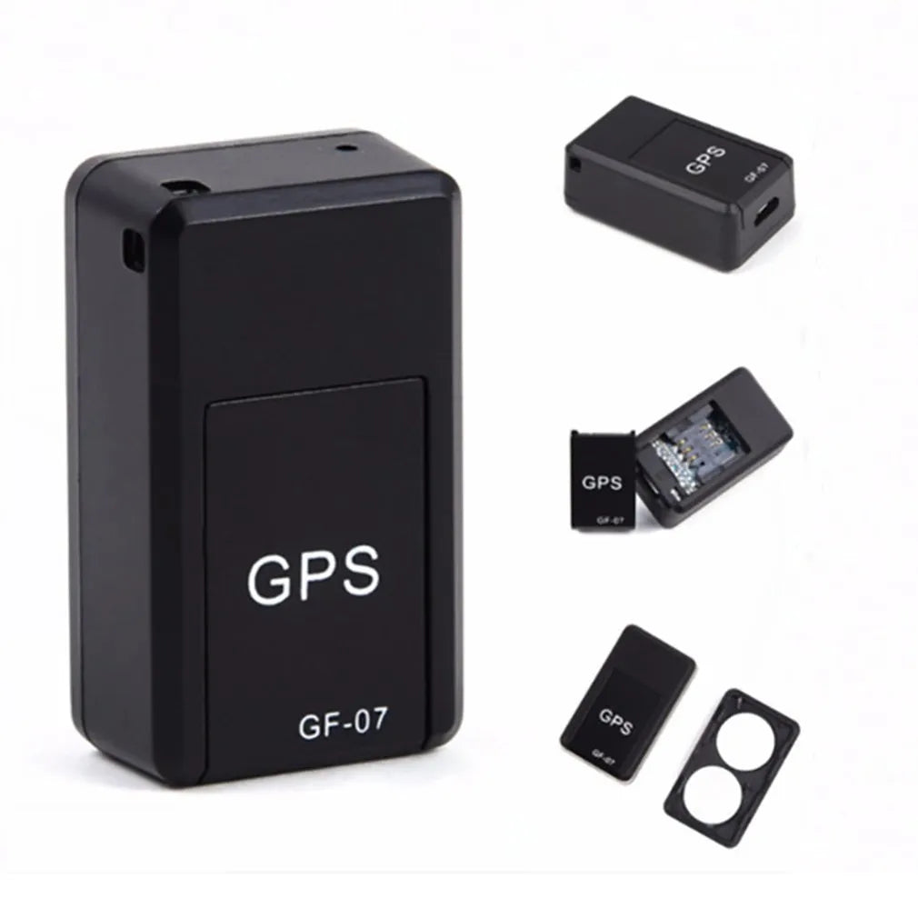 Small black magnetic GPS tracker device with USB cable for real-time vehicle and asset tracking.