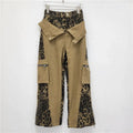 Dark khaki leopard print high-waist straight-leg jeans with retro tooling stitching details.