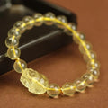 Yellow leather bracelet with citrine artificial crystal beads and Pi Xiu charm in Chinese national style.