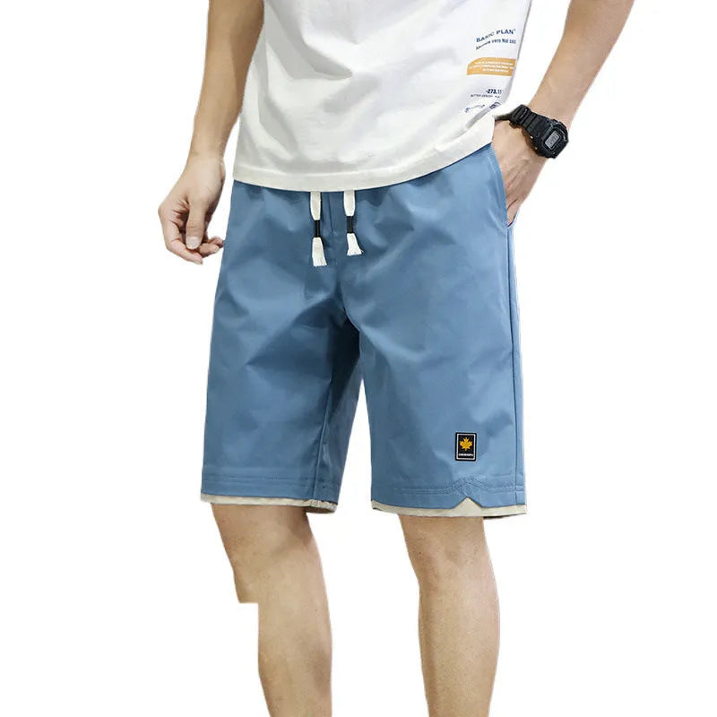 Casual polyester beach shorts with micro elasticity in Korean loose style, available in green, black, khaki and blue colours