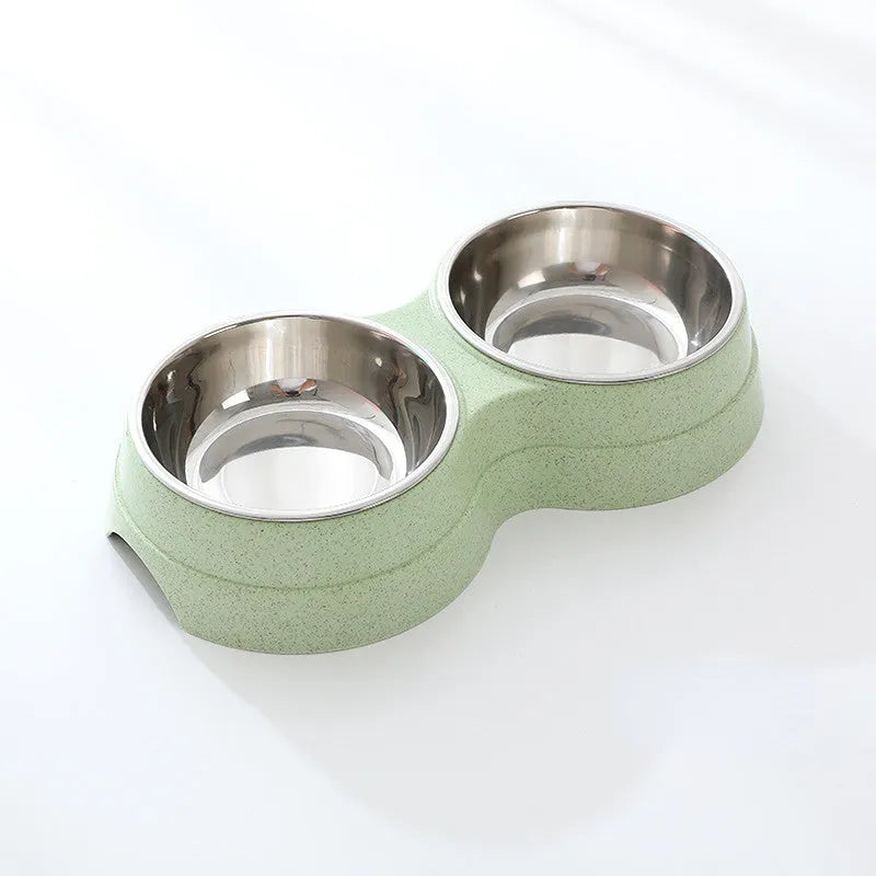 Double pet bowl set with two stainless steel bowls and blue straw holder on white background