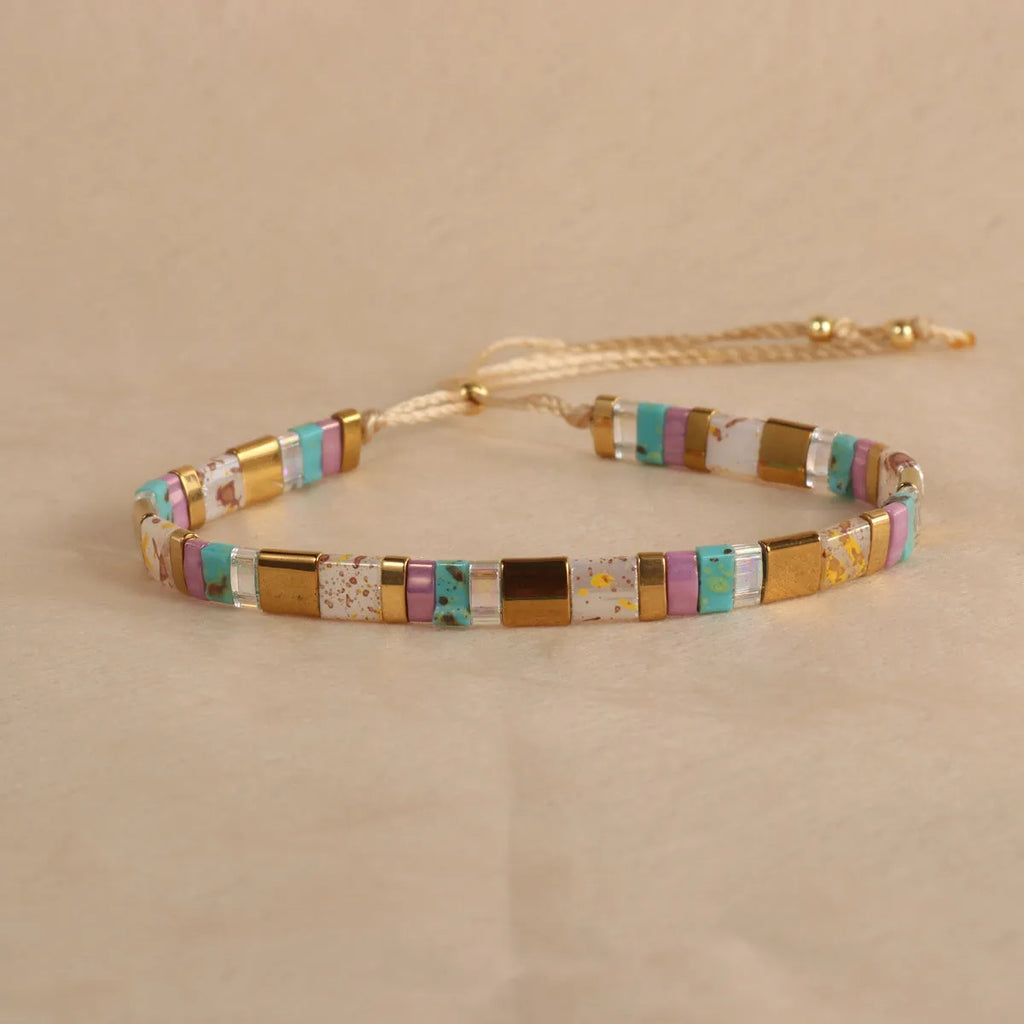 Geometric beaded bracelet with round glass and coloured glaze beads in five colour options.