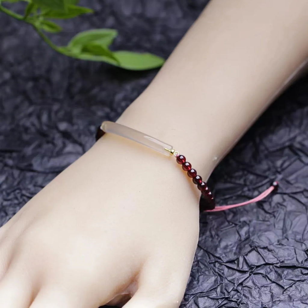 Red garnet and natural agate beaded bracelet with pull-adjustable closure on wrist