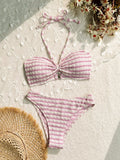 Women's pink and black striped bikini swimsuit top and briefs on a mannequin