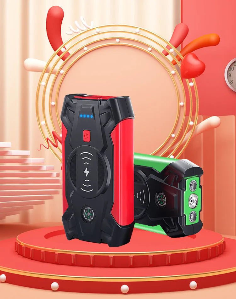 Red car emergency jump starter power pack with digital display and strong jumper clamps.