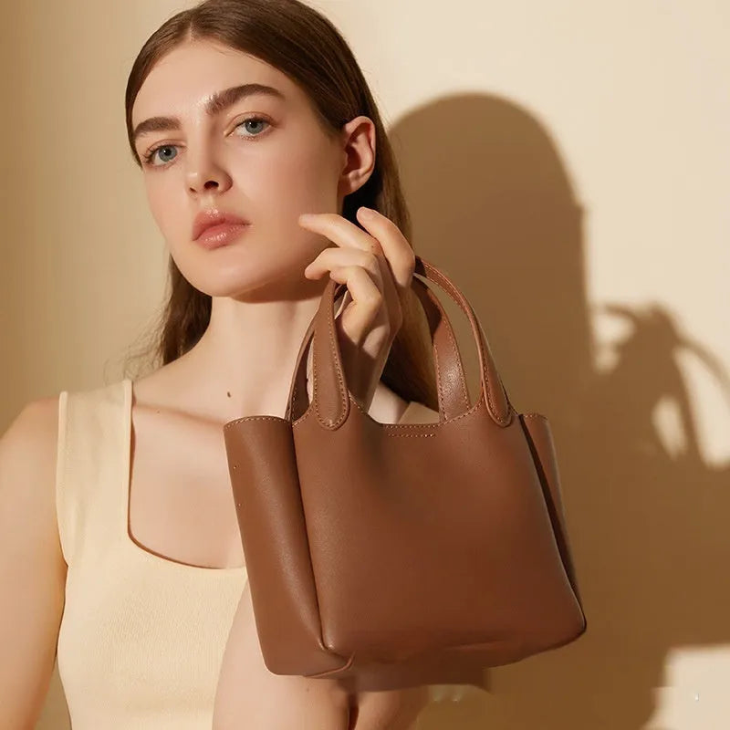 Brown genuine cattlehide leather cross body bucket bag with retro style and single shoulder strap