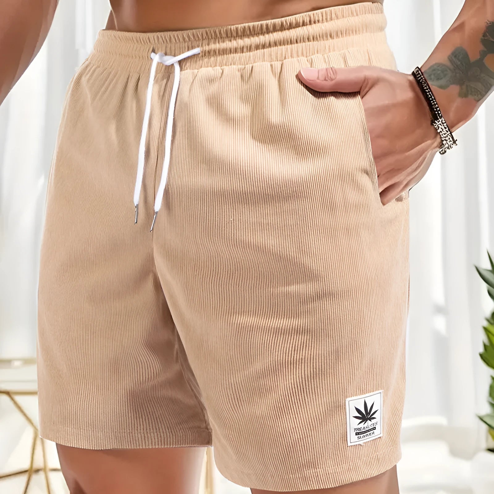 Man's pair of grey straight-leg summer shorts with a drawstring elastic waistband.