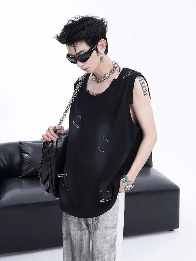 Man's black ripped irregular sleeveless vest t-shirt with asymmetric hem on a plain background.