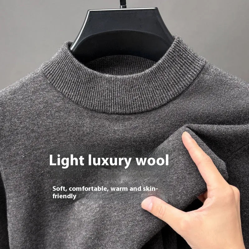 Men's solid colour fine yarn half turtleneck long sleeve pullover sweater on a hanger.