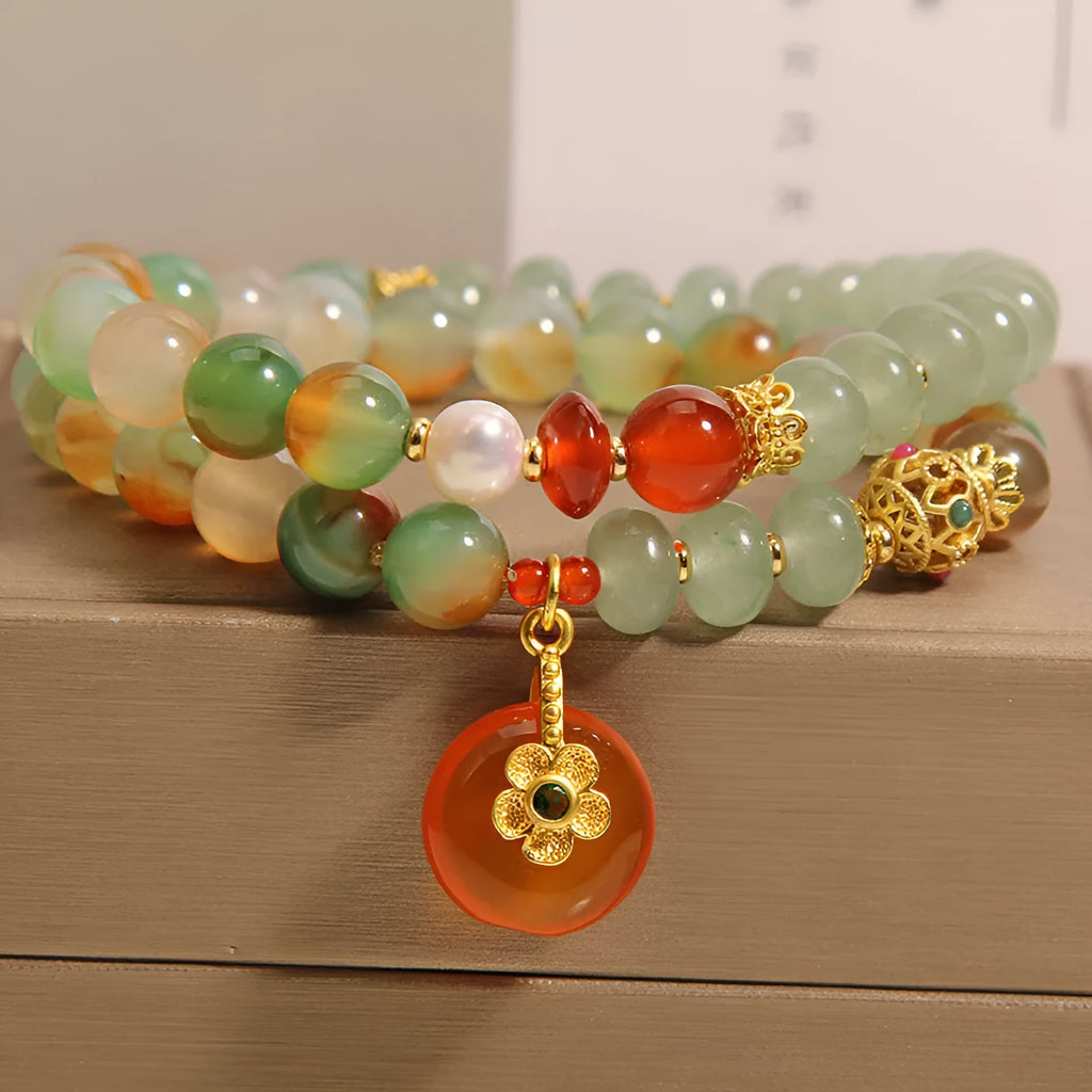 Women's peacock green agate double ring bracelet with alloy construction and safety buckle clasp.