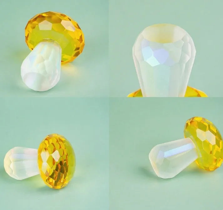 Colourful mushroom-shaped crystal decoration in geometric style on a surface, showing light green hue.
