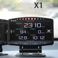 X1 automotive OBD diagnostic instrument with LED display and metal construction showing thickness measurement