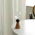 Nordic geometric bubble glass vase with wooden base showing conical and arc bottom designs