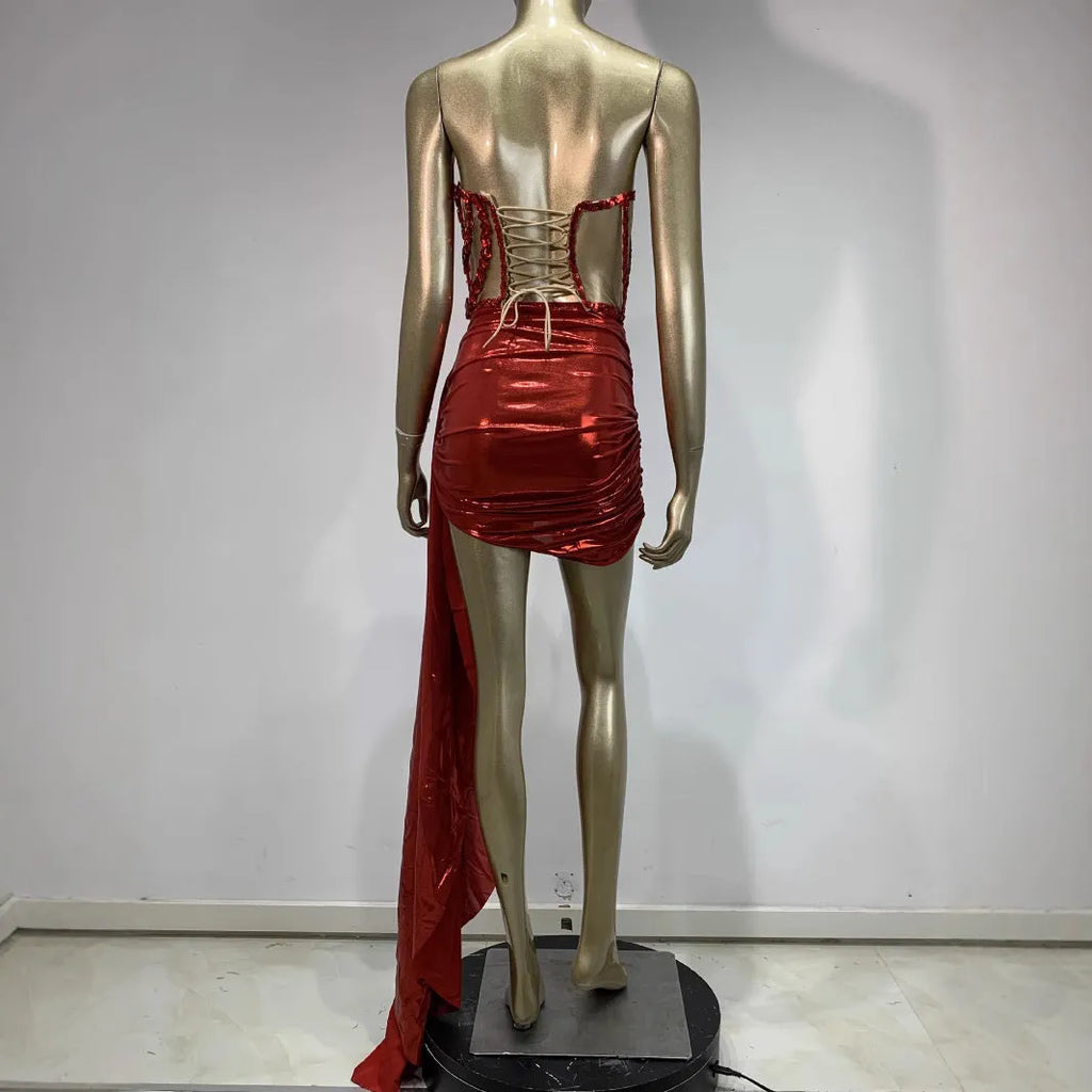 Red two-piece stage costume with hollow mesh panels and a skirt, made from stretch spandex for performers.